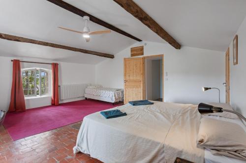 a bedroom with a large bed in a room at Grand mas provencal in La Farlède