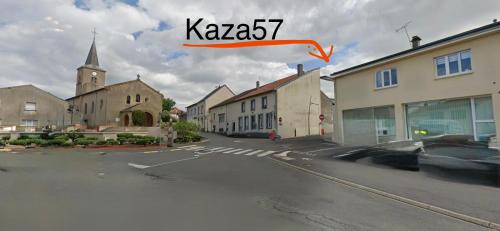 a view of an empty street with a church at Appart orange 25 m2 neuf RDC in Sainte-Marie-aux-Chênes