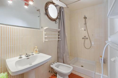 a bathroom with a sink and a toilet and a shower at Grand mas provencal in La Farlède