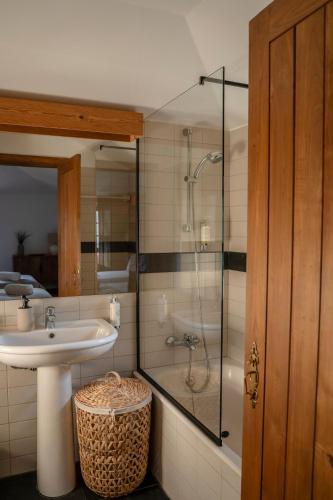 a bathroom with a sink and a shower at Quinta De São José in Ervedosa do Douro