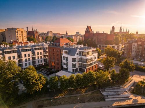 an aerial view of a city with buildings at GRANO HOTEL Gdańsk Riverside in Gdańsk
