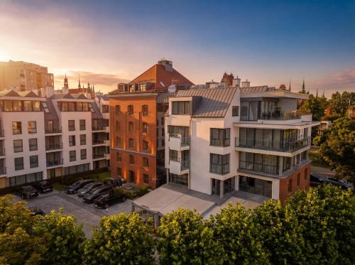 an aerial view of a city with buildings at GRANO HOTEL Gdańsk Riverside in Gdańsk