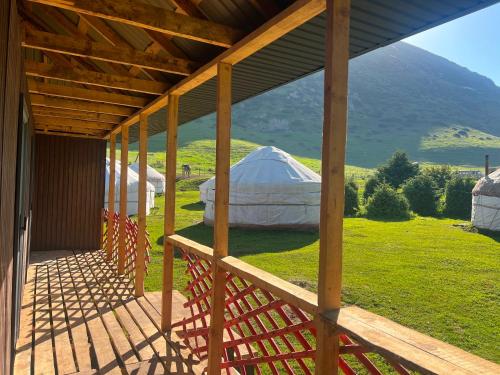 a view of a yurt from the porch of a house at Forest Yurt House Altyn Arashan in Mineralʼnyy Istochnik Altyn-Arasan
