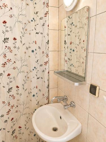 a bathroom with a sink and a mirror at DW Viva in Rewal