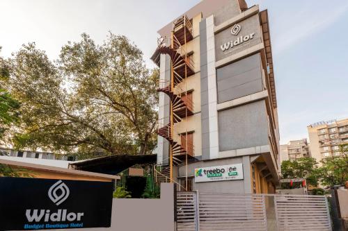 a building with a sign in front of it at Treebo Premium Widlor Boutique with Swimming Pool in Mumbai