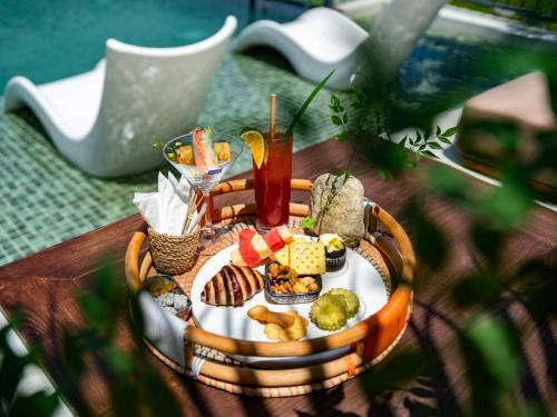 a tray of food on top of a table at Hotel LaVue Tam Coc in Ninh Binh