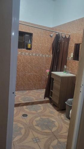 a bathroom with a shower and a sink and a shower at Mayumi weekend accommodation in Cocoyoc
