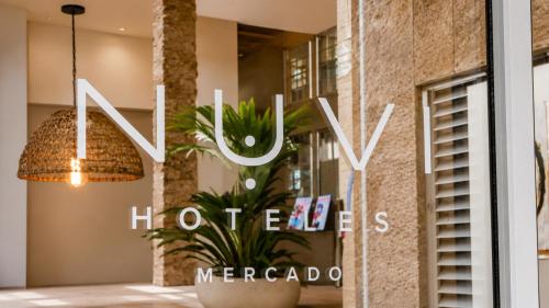a sign in a window of a hotel at Nuvi Mercado in Alicante