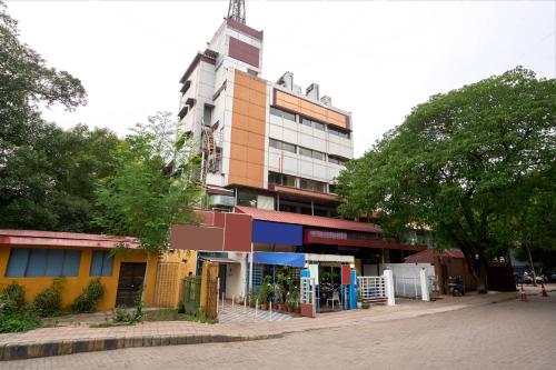 a tall building with a tower on top of it at Itsy Hotels Aditya in Nagpur