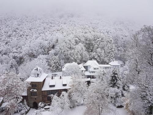 an aerial view of a house covered in snow at Hotel & Restaurant Schaumburger Ritter, Rinteln in Rinteln