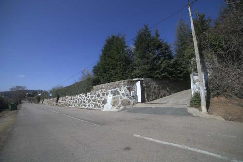 a stone wall on the side of a road at Quinta da Boa Ventura in Bragança