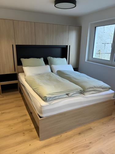 a bedroom with a large bed in a room at Moderne Studio Oase in Donaueschingen