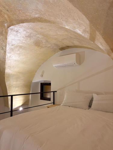 a bedroom with a large white bed in a room at Stella Apartment in Nardò