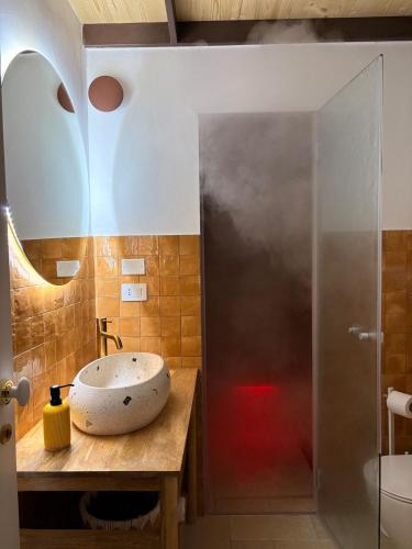 a bathroom with a sink and a shower at Stella Apartment in Nardò