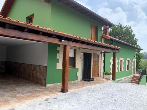 a green house with a pathway in front of it at R2R - Casa Los Abuelos - C19A02 in Gormazo