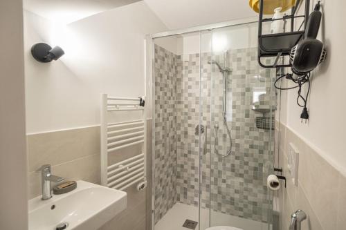a bathroom with a shower and a sink at Al Cantuccio Affittacamere in Assisi