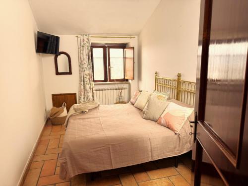 a bedroom with a bed in a room with a window at La Dolce Casa Centre Free Parking Family in Celano