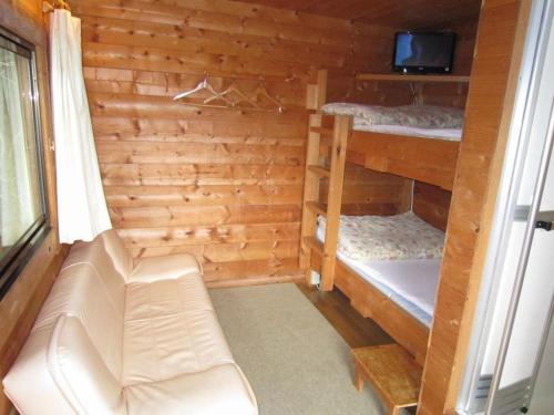 a room with two bunk beds and a couch at Strawberry Farm Shirasaki in Yura