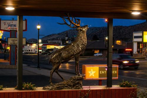 a statue of a reindeer on the side of a street at Mountain Star Inn Cedar City in Cedar City