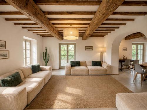 a living room with two couches and a table at Tenuta Seriole in Poppi