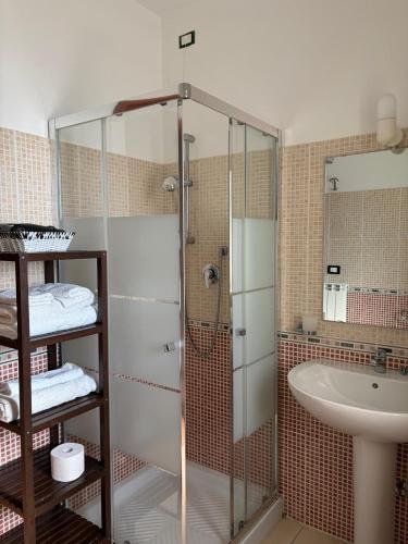 a bathroom with a shower and a sink at Villa Andrea B&B in San Silvestro
