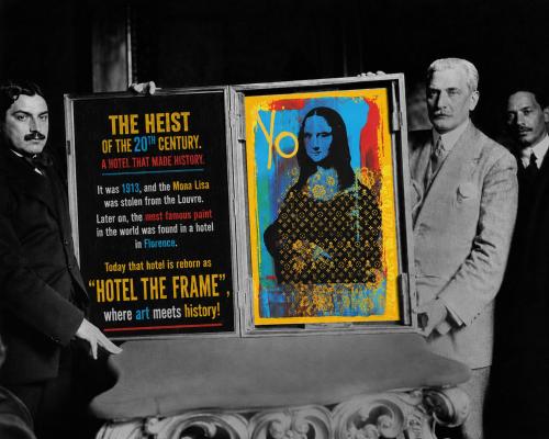 a group of people standing next to two posters at The Frame Hotel in Florence