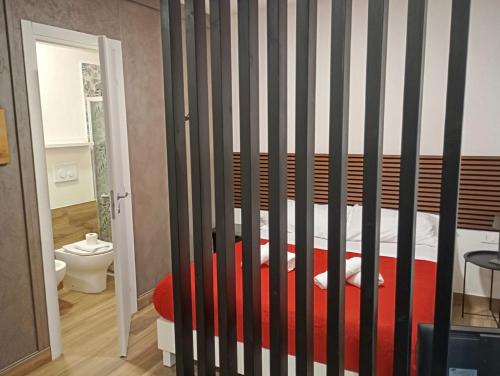 a bedroom with a bed with black and white stripes at Borgo Mantova in Potenza