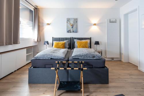 a bedroom with two beds with yellow pillows at Ferienwohnung 1 Gasthaus Bußmann Vreden in Vreden