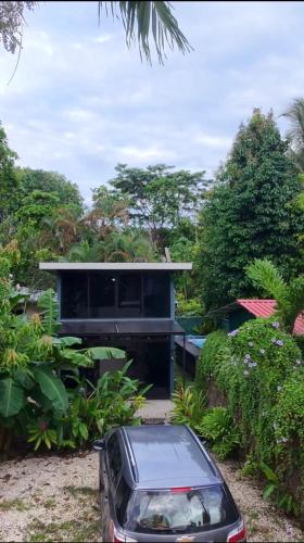 a car parked in front of a house at Nani House in Montezuma