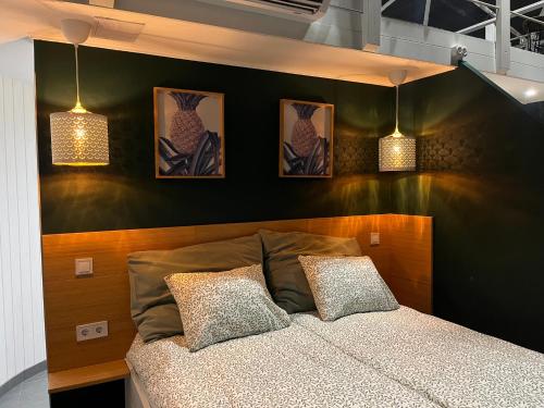 a bedroom with a bed with two pillows on it at DOMEGLAMPING at FISHINGLAKE in Ságvár