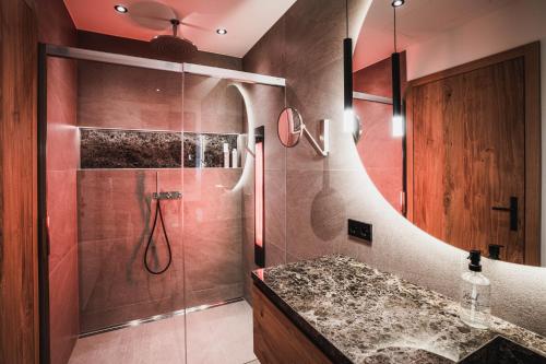 a bathroom with a shower with a glass shower stall at Chalet am Wetterkreuz in Reit im Winkl