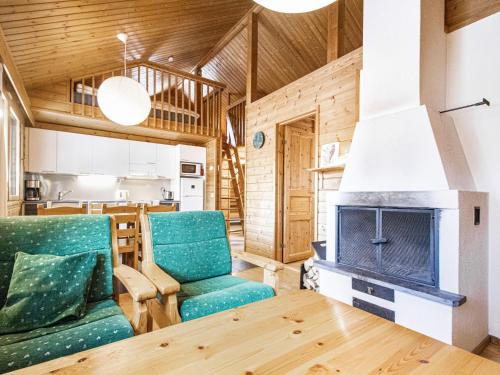a living room with a couch and a fireplace at Holiday Home Naavarinne by Interhome in Muonio