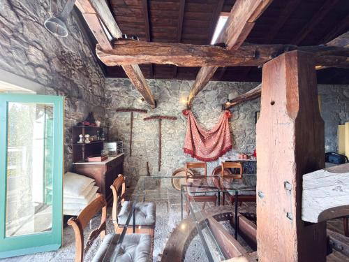 a room with a bed and a table and chairs at Quinta das Buganvílias in Castelo Branco
