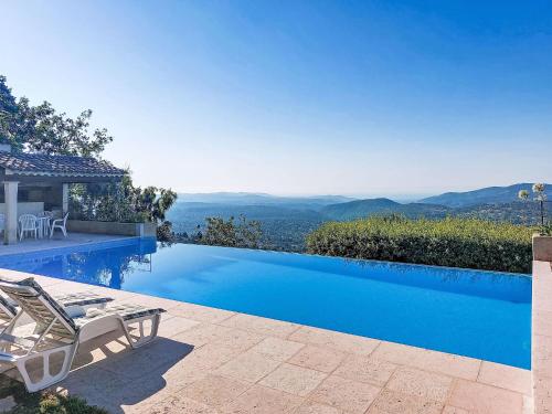 a villa with a swimming pool with a view at Villa Balcon d'Azur by Interhome in Spéracèdes