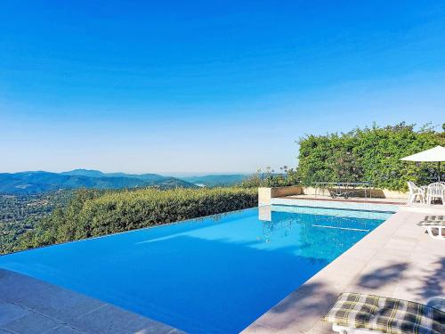 a swimming pool with a view of the mountains at Villa Balcon d'Azur by Interhome in Spéracèdes