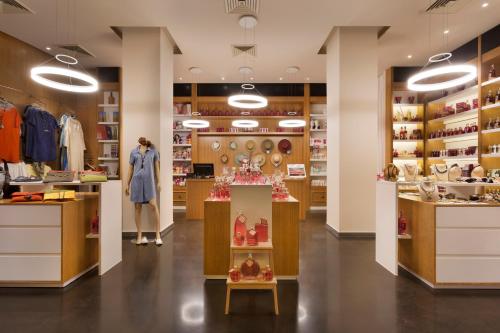 a store with a woman standing in the middle of the room at Cramim by Isrotel Exclusive in Qiryat ‘Anavim
