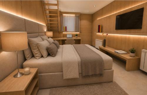 a bedroom with a large bed and a television at Plaza Paradiso by Camberland in Chacras de Coria