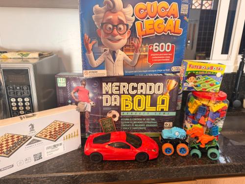a toy car on a counter next to a box of cereal at Sobrado 111 in Ponta Grossa