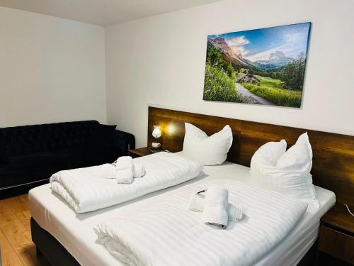 a bedroom with two beds with white pillows at Haus Wandertal in Zella-Mehlis