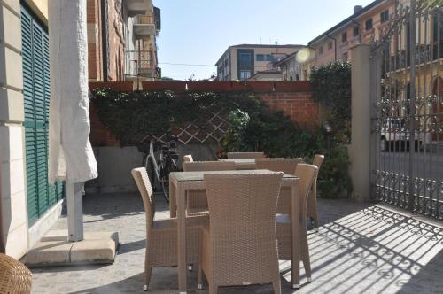 a table and chairs sitting on a patio at Hotel Vittoria in Viareggio