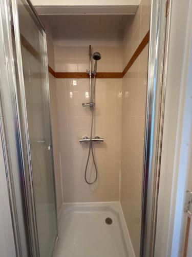 a bathroom with a shower with a shower at Chambres Kergana in Landéda