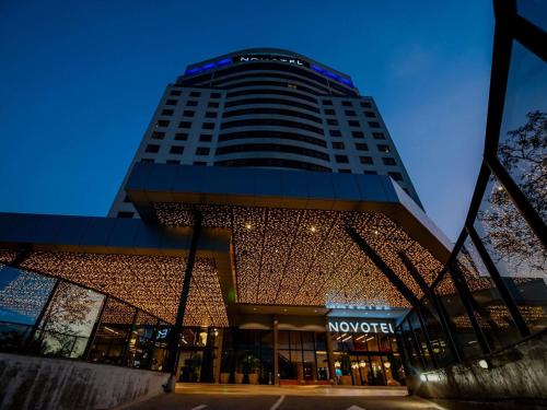a building with a sign on top of it at Novotel Uberlândia in Uberlândia
