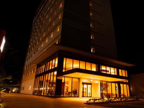 a large building at night with its lights on at ibis Jaú in Jaú