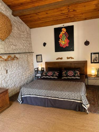 a bedroom with a bed in a room at Dormir Ben Aise Hammam Massages in Maillezais