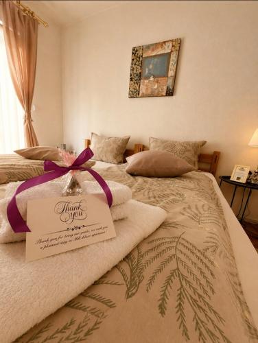 a bedroom with two beds with towels on it at MB Deluxe Apartment in Visoko