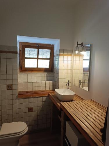 a bathroom with a sink and a toilet and a window at B&B Residenza Gigina in Sezze