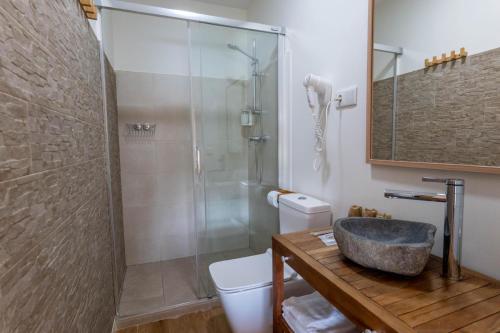 a bathroom with a shower and a sink at La Casita de Melón in Suances