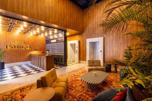 a lobby with a hotel indico sign on the wall at Hotel Indigo Tijuana Downtown by IHG in Tijuana