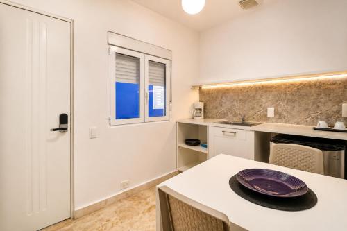 a kitchen with a table with a plate on it at Casa roof in Las Terrenas