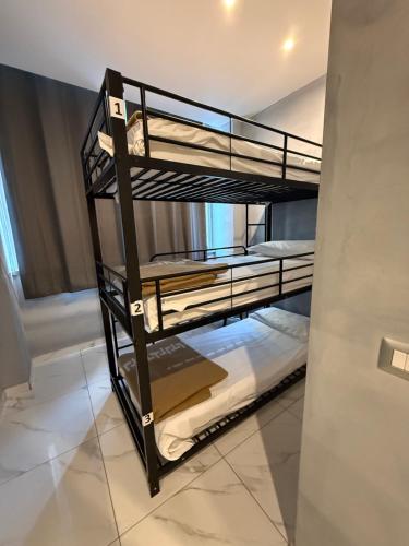 a couple of bunk beds in a room at Monkey Hostel Milano in Milan